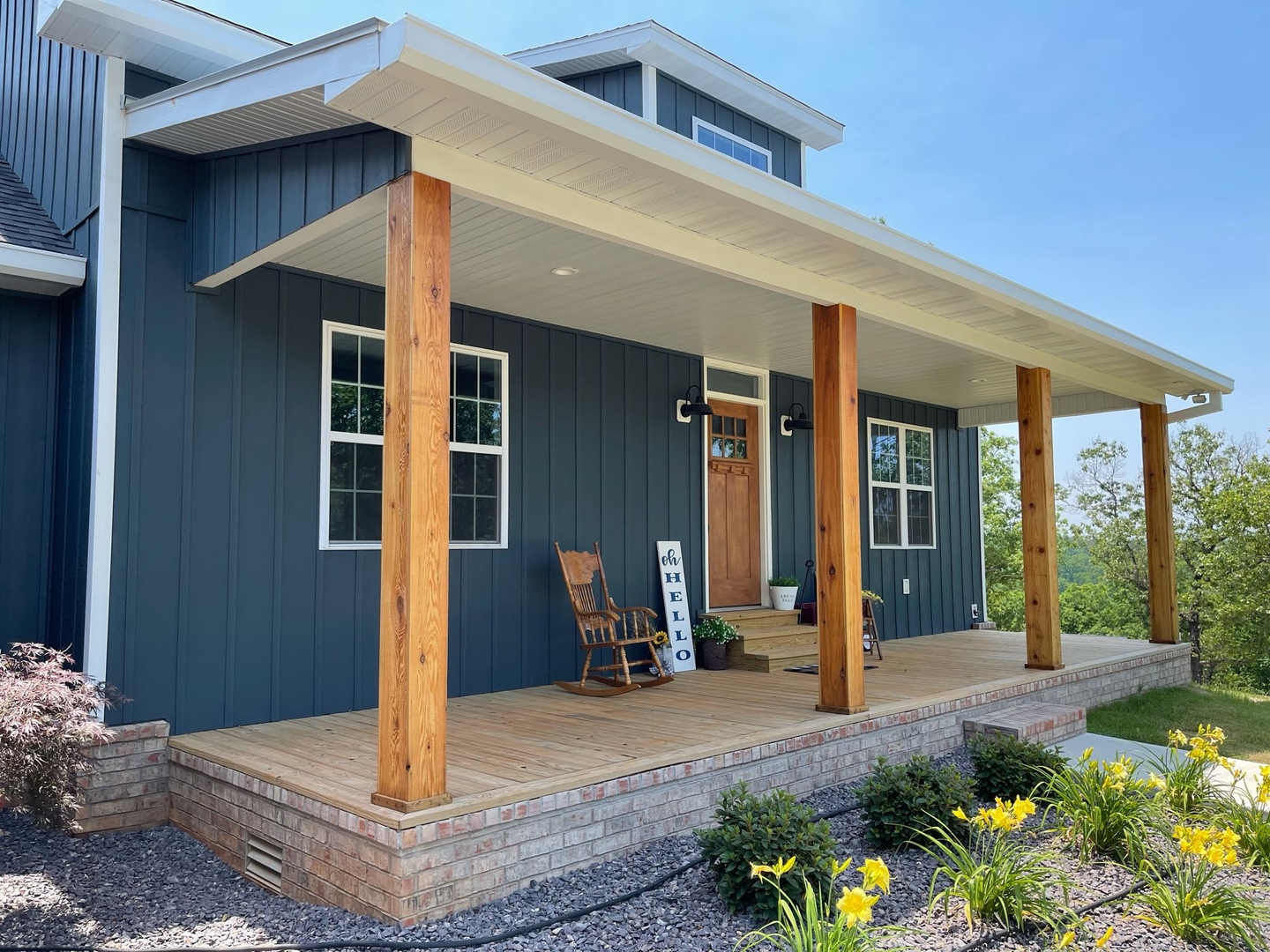 Dark blue board and batten siding farmhouse