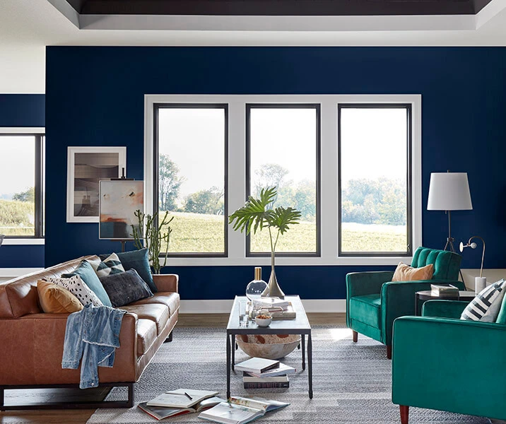 Casement windows in bold navy living room