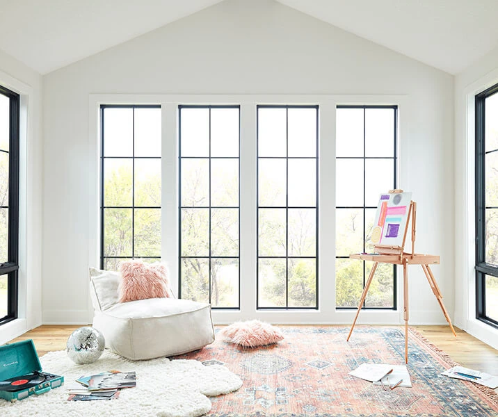 Double-hung windows in bright painting room
