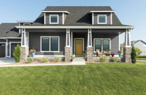 Gray home with green lawn